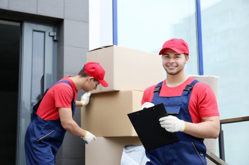 Removal team planning a move in Earls Court with packed boxes