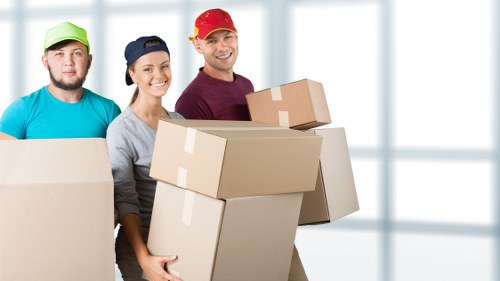 Loading furniture into a moving truck for an Earls Court flat move
