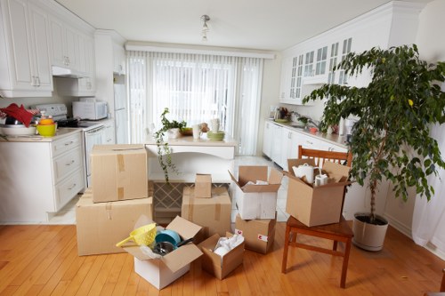 Packed boxes and furniture ready for local removal service