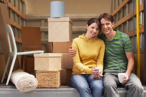 Careful wrapping of fragile household items for moving day